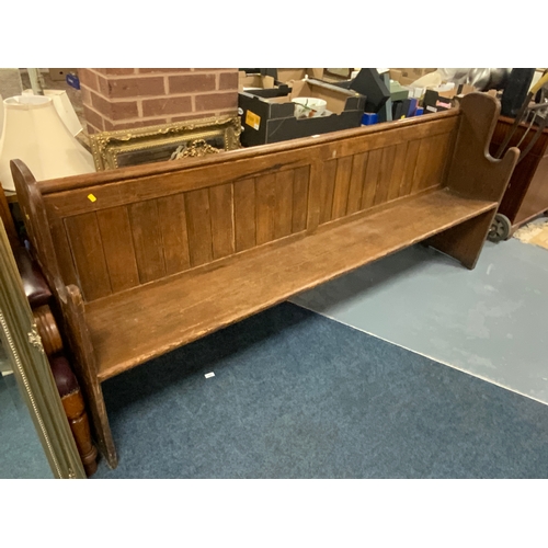 754 - An antique pine church pew L 228 cm