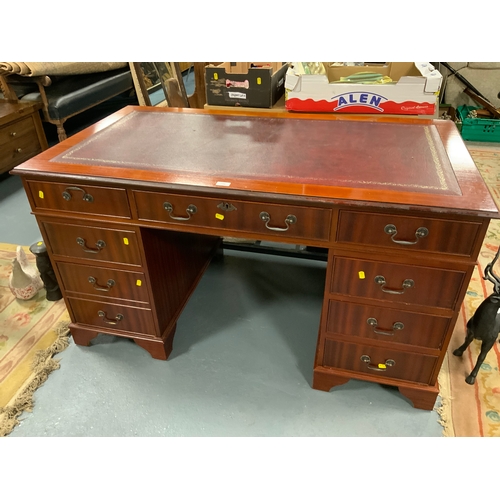 756 - A mahogany twin pedestal desk with inset leather writing surface W 138 cm