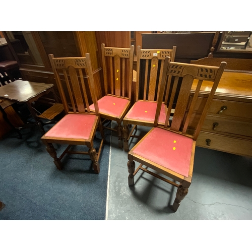 764 - A set of four oak dining chairs