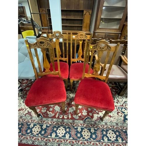 784 - A set of  four Edwardian mahogany carved dining chairs