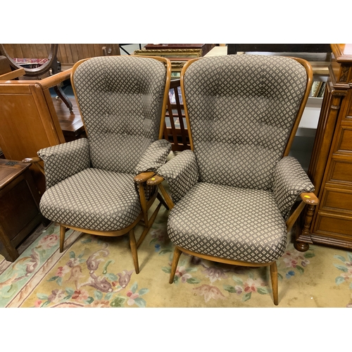 793 - A pair of Ercol upholstered armchairs