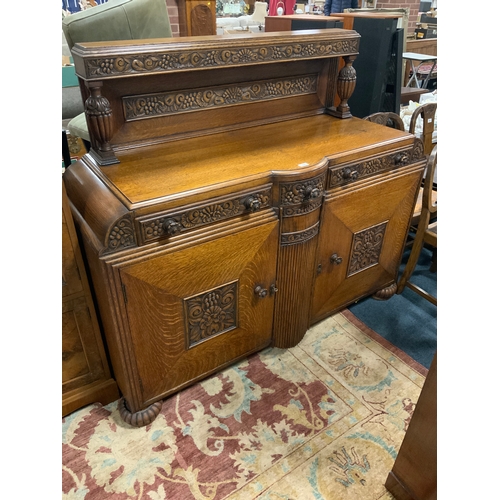 804 - A heavy carved oak sideboard W 150 cm