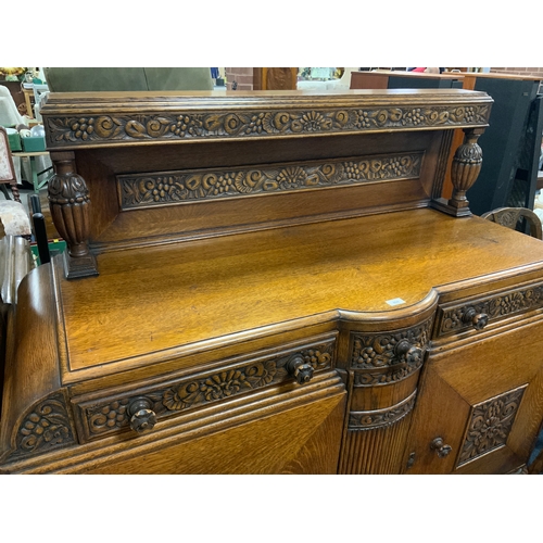 804 - A heavy carved oak sideboard W 150 cm