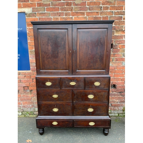 831 - A Georgian mahogany cupboard on chest with an arrangement of nine drawers H 185 cm W 123 cm