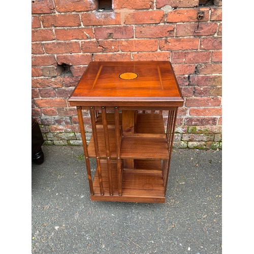 832 - A reproduction mahogany inlaid revolving bookcase