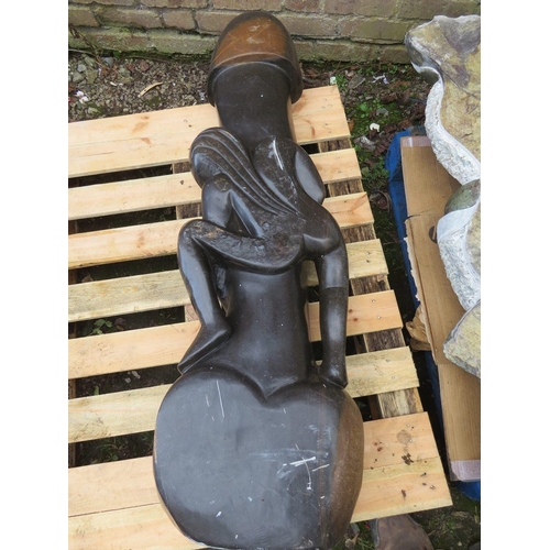 559 - A large stone  type erotic statue of a lady 'The Hugger' - H 140 cm. W 45 cm