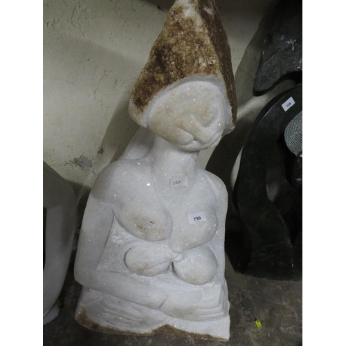 566 - A white marble type statue of a lady feeding a baby - H 90 cm, W 40 cm