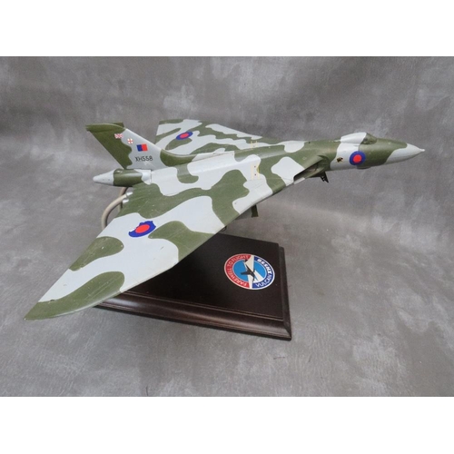 203 - A model of a Vulcan bomber XH558 on display stand, wing span 47 cm