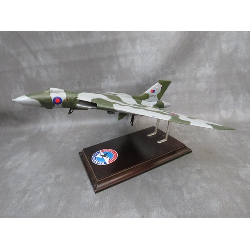 203 - A model of a Vulcan bomber XH558 on display stand, wing span 47 cm