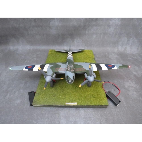 204 - A model of a DeHavilland Mosquito Mk4 on display stand, with working propellors and wing lights, win... 