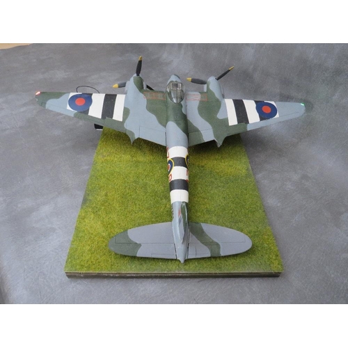 204 - A model of a DeHavilland Mosquito Mk4 on display stand, with working propellors and wing lights, win... 