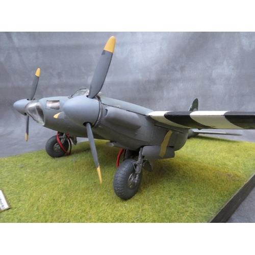 204 - A model of a DeHavilland Mosquito Mk4 on display stand, with working propellors and wing lights, win... 