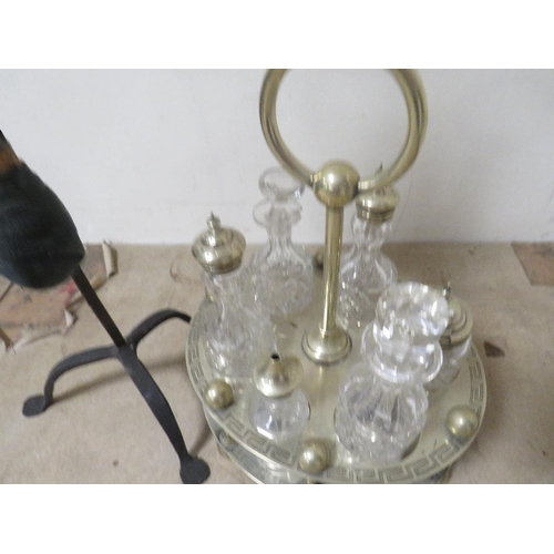 215 - An unusual table gong together with a six bottle silver plated cruet