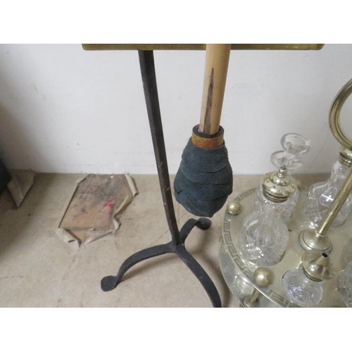 215 - An unusual table gong together with a six bottle silver plated cruet