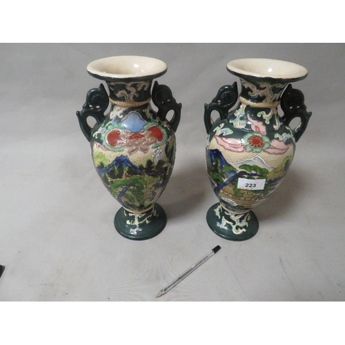 223 - A pair of modern Oriental themed vases