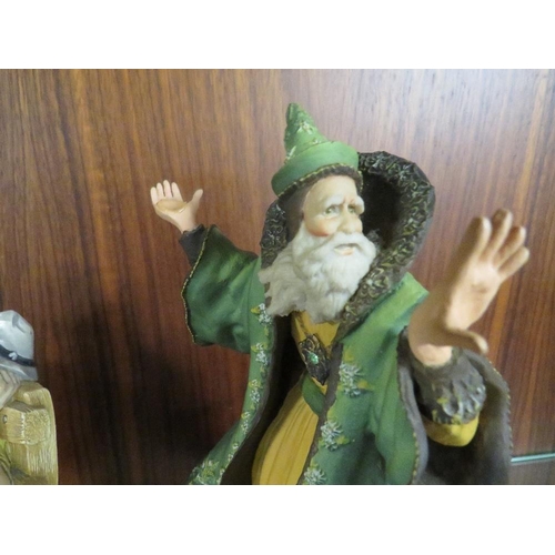 233 - An Enchantica figure of a wizard in a green cloak together with a Naturecraft figure entitled 'Sprin... 