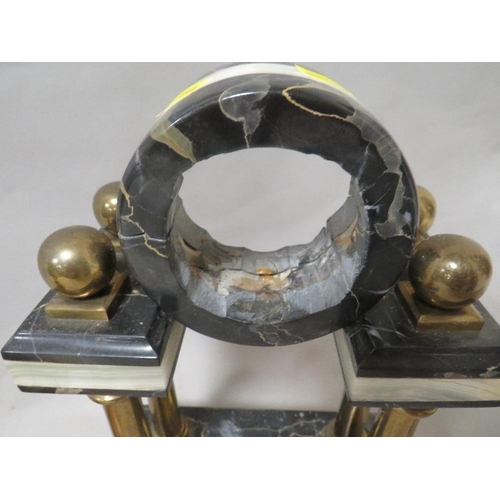 246 - A cast metal clock garniture figure on plinth together with a marble style portico clock mount