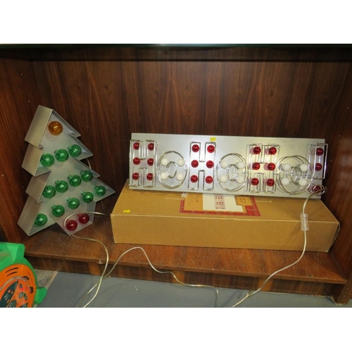 304 - A boxed new old stock HoHoHo! illuminated Christmas sign together with a similar illuminated Christm... 