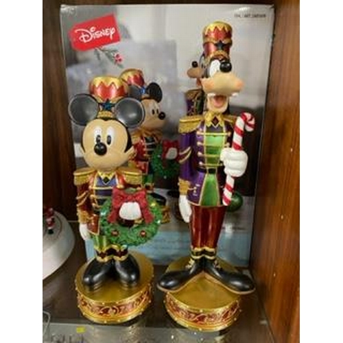 305 - A set of Christmas Disney Mickey Mouse and Goofy nutcracker figures with lights and music, boxed new... 