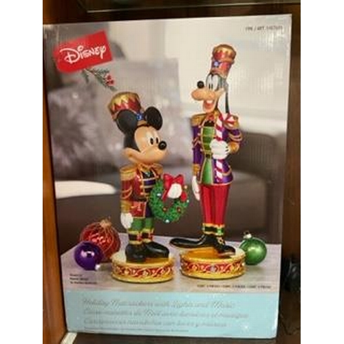 305 - A set of Christmas Disney Mickey Mouse and Goofy nutcracker figures with lights and music, boxed new... 