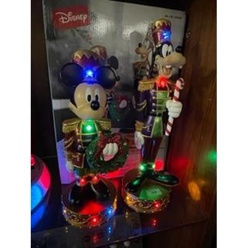 305 - A set of Christmas Disney Mickey Mouse and Goofy nutcracker figures with lights and music, boxed new... 