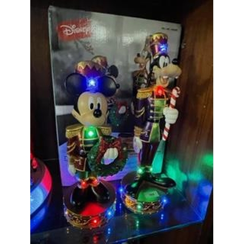 305 - A set of Christmas Disney Mickey Mouse and Goofy nutcracker figures with lights and music, boxed new... 