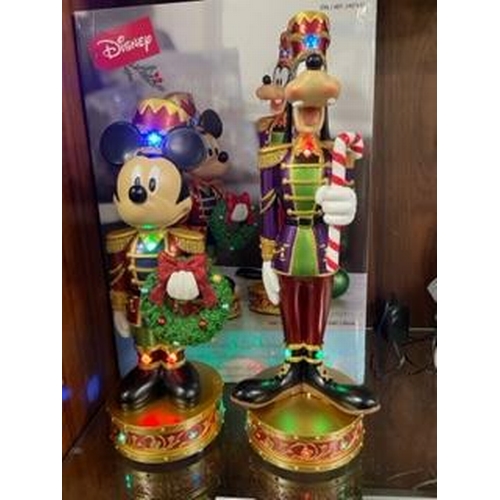 307 - A set of Christmas Disney Mickey Mouse and Goofy nutcracker figures with lights and music, boxed new... 