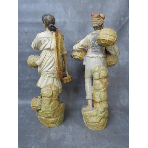 320 - A pair of large terracotta Continental hand painted figures, early 20th century, depicting fishermen... 