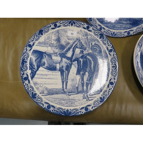 53 - Three Delfts Blauw hand painted equestrian themed chargers together with a tray of blue and white wa... 