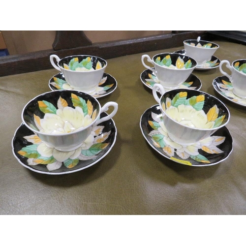 66 - Six hand painted floral design Tuscan cups and saucers