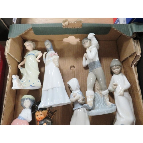 96 - A tray of assorted figurines to include various Nao figures