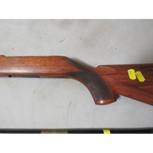 268 - A rifle stock and two cleaning rods