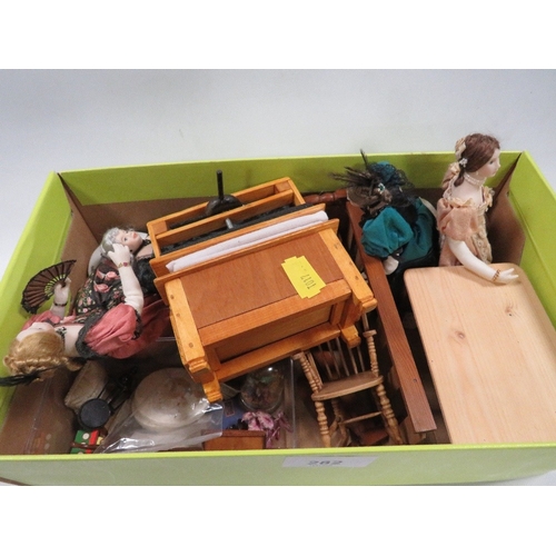 282 - A small collection of miniature dolls and dolls house furniture