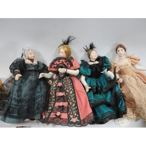 282 - A small collection of miniature dolls and dolls house furniture