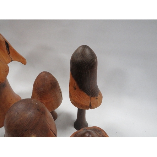 283 - A collection of carved wooden mushrooms