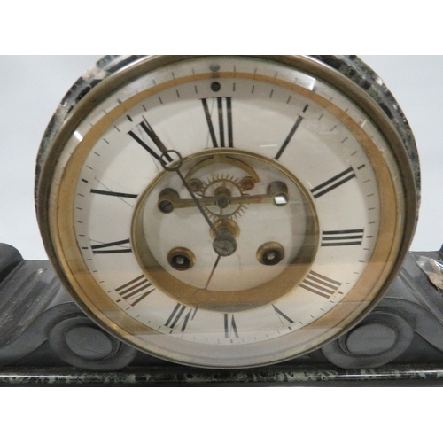 285 - A marble and black slate drum head mantle clock with visible escapement