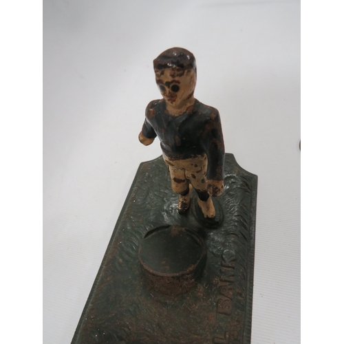 294 - A vintage cast iron novelty money bank in the form of a footballer taking a penalty RdNo 247326