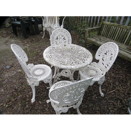 551 - A cast aluminium garden set comprising table and four chairs