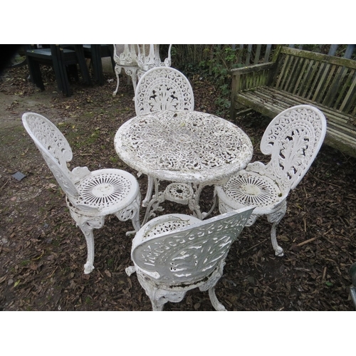 551 - A cast aluminium garden set comprising table and four chairs