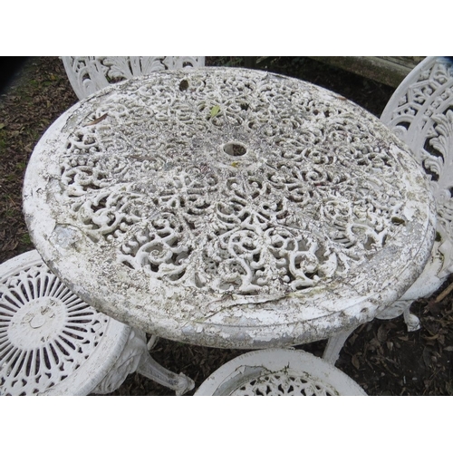 551 - A cast aluminium garden set comprising table and four chairs