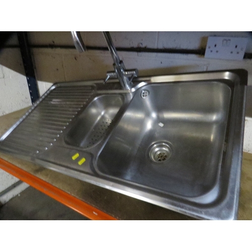 578 - A stainless steel gas hob / extraction unit together with a sink