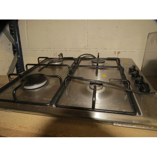 578 - A stainless steel gas hob / extraction unit together with a sink