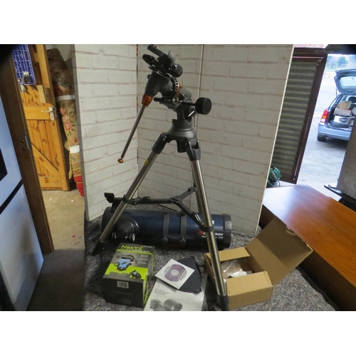 580 - A Celestron Astromaster 130 telescope and accessories