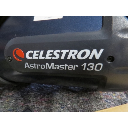 580 - A Celestron Astromaster 130 telescope and accessories