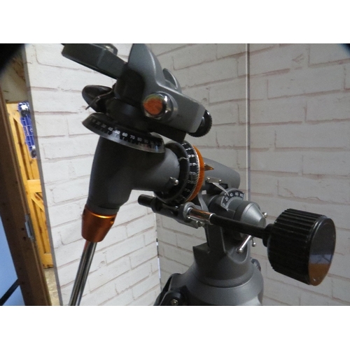 580 - A Celestron Astromaster 130 telescope and accessories