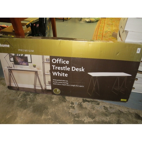 583 - A boxed office trestle desk in white