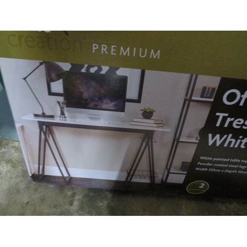 583 - A boxed office trestle desk in white