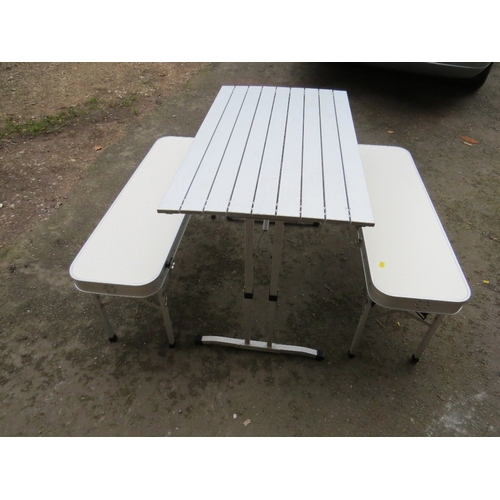 594 - A lightweight foldaway aluminium camping / dining set table and benches