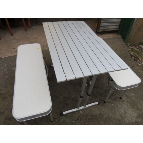 594 - A lightweight foldaway aluminium camping / dining set table and benches