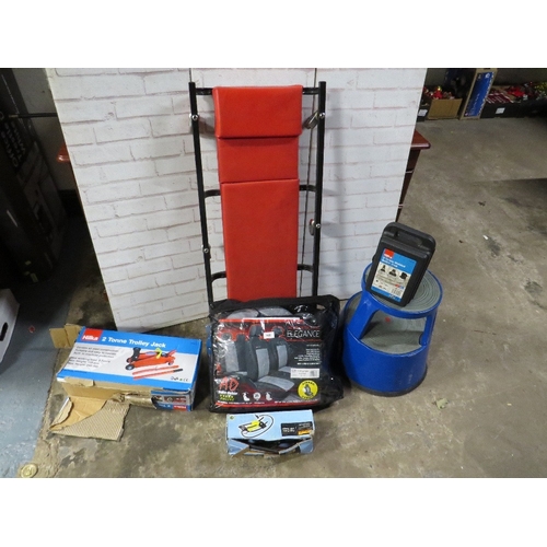 608 - A selection of mechanics items to include boxed jacks, a crawler trolley, tyre pump, car seat covers... 